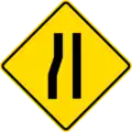 Narrows road on left