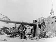 Japanese 14-cm gun emplacement on Tarawa 1943; note holes in gun shield