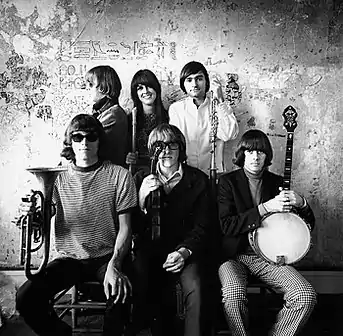 Jefferson Airplane photographed by Herb Greene at the Matrix, San Francisco, in late 1966. Top row from left: Jack Casady, Grace Slick, Marty Balin; bottom row from left: Jorma Kaukonen, Paul Kantner, Spencer Dryden. A cropped version of this photo was used for the front cover of Surrealistic Pillow.