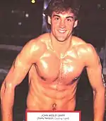 A muscular man with brown hair.