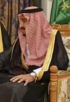 Image 13Red and white keffiyeh commonly worn in the desert held with a black agal (from Culture of Saudi Arabia)