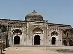 Khairul Manzil, a mosque and later a madarsa built by Maham Anga, stands opposite Purana Qila.