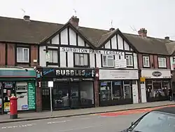 The last surviving public evidence of the name Surbiton Park. The pillar box marks the site of the former sub-post office.