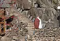Monk ascending stairway to Jijang Hall