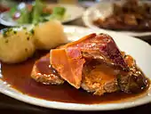 Krustenbraten mit Dunkelbiersoße, baked pork served with a dark beer sauce.