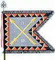 The traditional colour of the Kymen jääkäripataljoona (Kymi Jaeger Battalion), nowadays a part of Karelia Brigade, is of the form defined for light infantry. The Kymi Jaeger Battalion follows the traditions of the 3rd Bicycle Battalion and carries that number on its colour, and the Order of the Cross of Liberty both as a streamer and as the point of the staff.