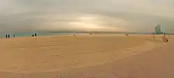 Barceloneta beach in winter, with W Barcelona Hotel