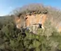 Lapa do Santo. Frontal view showing the cave entrance and sheltered area (drone).