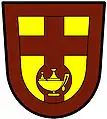 a Latin cross throughout (aka a cross enhanced) - Or; a Latin cross throughout, the lower limb nowy, murrey, charged on the node with a lamp inflamed, or; within a bordure murrey - Mmabatho College of Nursing, RSA