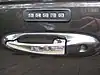 Outside door handle of a 1998 Lincoln Town Car, featuring digital lock.