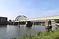 Train bridge over the river Maas in Maastricht on the railway to Hasselt