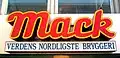Close-up of the company logo over the main office entrance