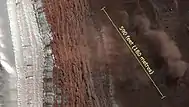 A photo with scale demonstrates the size of the avalanche.