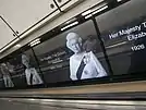 A photo of Elizabeth II on a series of screens