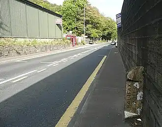 The section of Halifax Road by the factory site Rimer was found dead next to (behind the wall on the right), shown in 2009. Today, the factory is now derelict and used as an industrial storage site, although the wall in the image remains.
