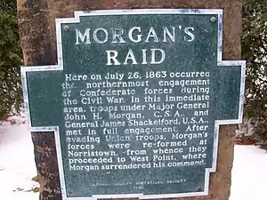 aluminum plaque bolted to sandstone. Plaque is shape of outline of Carroll County, Ohio, with raised letters that read : MORGAN'S RAID Here on July 26, 1863 occurred the northernmost engagement of Confederate forces during the Civil War. In this immediate area, troops under Major General John H. Morgan, C.S.A., and General James Shackleford, U.S.A., met in full engagement. After evading Union troops, Morgan's forces were re-formed at Norristown, from whence they proceeded to West Point, where Morgan surrendered his command.  CARROLL COUNTY HISTORICAL SOCIETY 1969