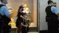 At about 8&nbsp;pm, a mother and her two young children holding flowers were surrounded and searched by police officers outside Sogo.