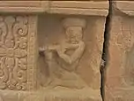 A detail from the Mỹ Sơn E1 pedestal shows a flutist playing his instrument.