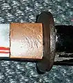 Then the tsuba is inserted too