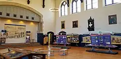 large, light-filled hall with freestanding exhibit plaques on display
