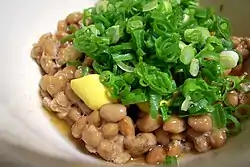 Nattō topped with karashi mustard and Welsh onion