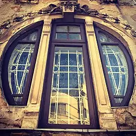 Stained glass window of the Romulus Porescu House, decorated with lotus flowers, Bucharest, Romania, 1905, by Dimitrie Maimarolu
