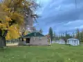 Cottage with yards and sheds in the hydroelectric complex.