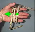 Pull the outmost loop inwards under the first two