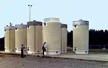 Image 23Dry cask storage vessels storing spent nuclear fuel assemblies (from Nuclear power)