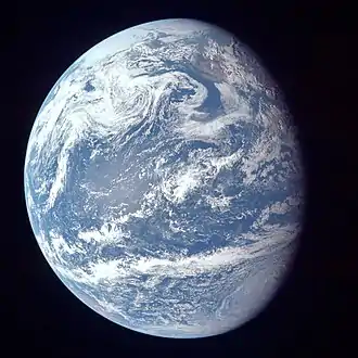 Image 53A view of Earth with its global ocean and cloud cover, which dominate Earth's surface and hydrosphere. At Earth's polar regions Earth's hydrosphere forms larger areas of ice cover. (from Earth)