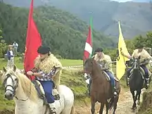 Riders with the Flag of Navarre, ikurrina and the Arrano beltza
