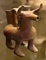 Bull-shaped oenochoe with earrings (Tarquinia National Museum)