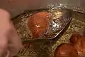 Oliebollen and similar doughnuts are fried in hot fat.