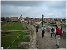 In 1433 on this spot—the bridge over the river Órbigo—Suero de Quiñones and ten of his knights challenged all comers to a Pas d'Armes, promising to "break 300 lances" before moving on.