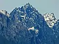 Merchant Peak centered, with the southeast subsidiary subpeak (5,831 ft) to the right. The subpeak is mistakenly labelled as Merchant Peak on old USGS maps.