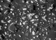 Deep-basin deposits from the floor of Eridania Sea.   The mesas on the floor are there because they were protected against intense erosion by deep water/ice cover.  CRISM measurements show minerals may be from  seafloor hydrothermal deposits.  Life may have originated in this sea.