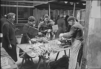 Potatoes and leeks on sale in a Paris market. There was little else to buy. Spring 1945 (Imperial War Museums, U.K.)