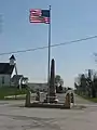 Warld War I veterans memorial in Pickrelltown (2010 photo). The 8 ft (2.4 m) high granite monument was erected in 1921, and has twice been rebuilt after vehicles crashed into it.