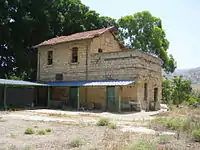 Former railway station of Al-Hamma, with a sign in Arabic reading "al-Hama".