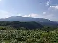 Plesa peak as seen from atop of Cornetul mountain.
