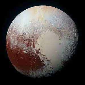 Image 2PlutoPhotograph: NASA / Johns Hopkins University Applied Physics Laboratory / Southwest Research InstitutePluto is a dwarf planet in the Kuiper belt, a ring of bodies beyond Neptune. Discovered by Clyde Tombaugh in 1930, Pluto was originally considered to be the ninth planet from the Sun. Following the discovery of several objects of similar size in the Kuiper belt, its status as a planet was questioned, and in 2006 the International Astronomical Union (IAU) gave a definition of the term "planet" that excluded Pluto. The largest and second-most-massive known dwarf planet in the Solar System, Pluto is primarily made of ice and rock. It is relatively small, with a moderately eccentric and inclined orbit.This photograph of Pluto is a composite of four near-true color images taken by the New Horizons spacecraft in 2015. The most prominent feature in the image, the bright, youthful, nitrogen ice plains of Sputnik Planitia, the left lobe of heart-shaped Tombaugh Regio, is at right center. This contrasts with the darker, more cratered terrain of Cthulhu Macula at lower left.More selected pictures