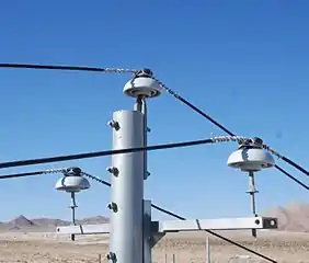 Power lines supported by ceramic pin-type insulators in California, USA
