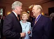 President Bill Clinton speaks with the Fords at the White House ceremony awarding the at a 1999 Presidential Medal of Freedom ceremony
