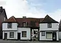 16th-century wooden framed house with centre cartway west of church in Prittlewell