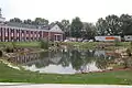 P-W Building & Pond. Only natural pond on campus.  Utilized by students in 1904 to save the other buildings from the fire in the Original Main Building.