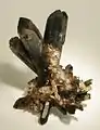 A two-sided cluster of glassy and lustrous, doubly terminated smoky quartz crystals from recent finds in Namaqualand, South Africa. The longest crystal is 8.1&nbsp;cm.