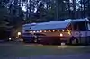 An motor home set up with party lights on the outside