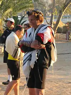 Rabbi Gordon Tucker participates in an early morning minyan, 2003