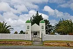 The Ratana Church at Te Kao is characterised by bell towers at each of the front corners, which bear the words "Arepa" and "Omeka" (Maori transliterations of the Greek words Alpha and Omega – the beginning and the end)