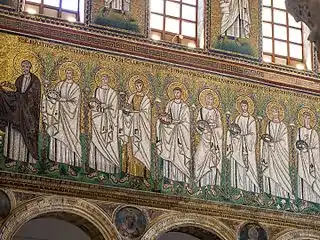The nave as seen from an aisle, featuring a mosaic of several saints.
